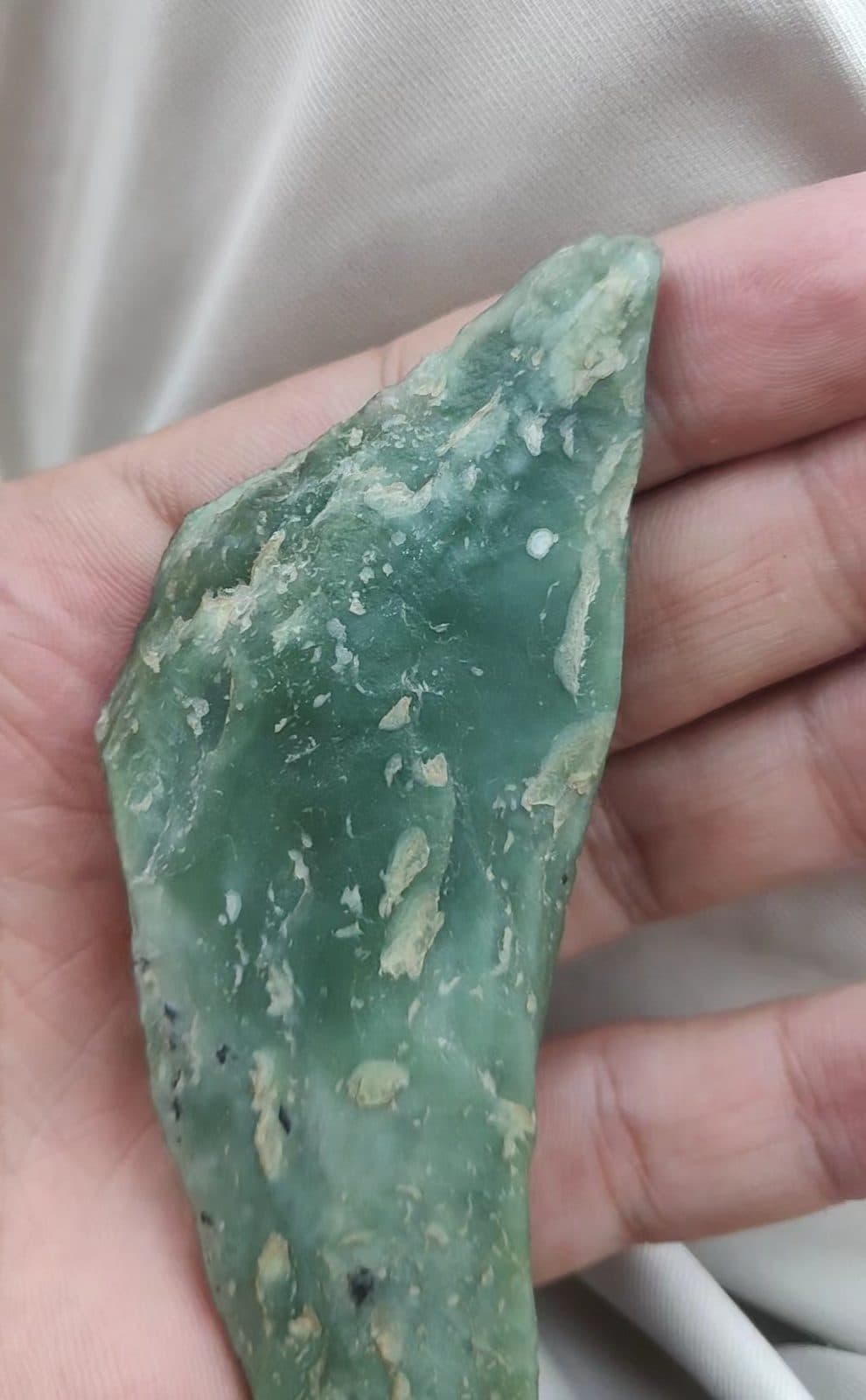 Apple-green nephrite with pale flecks.
