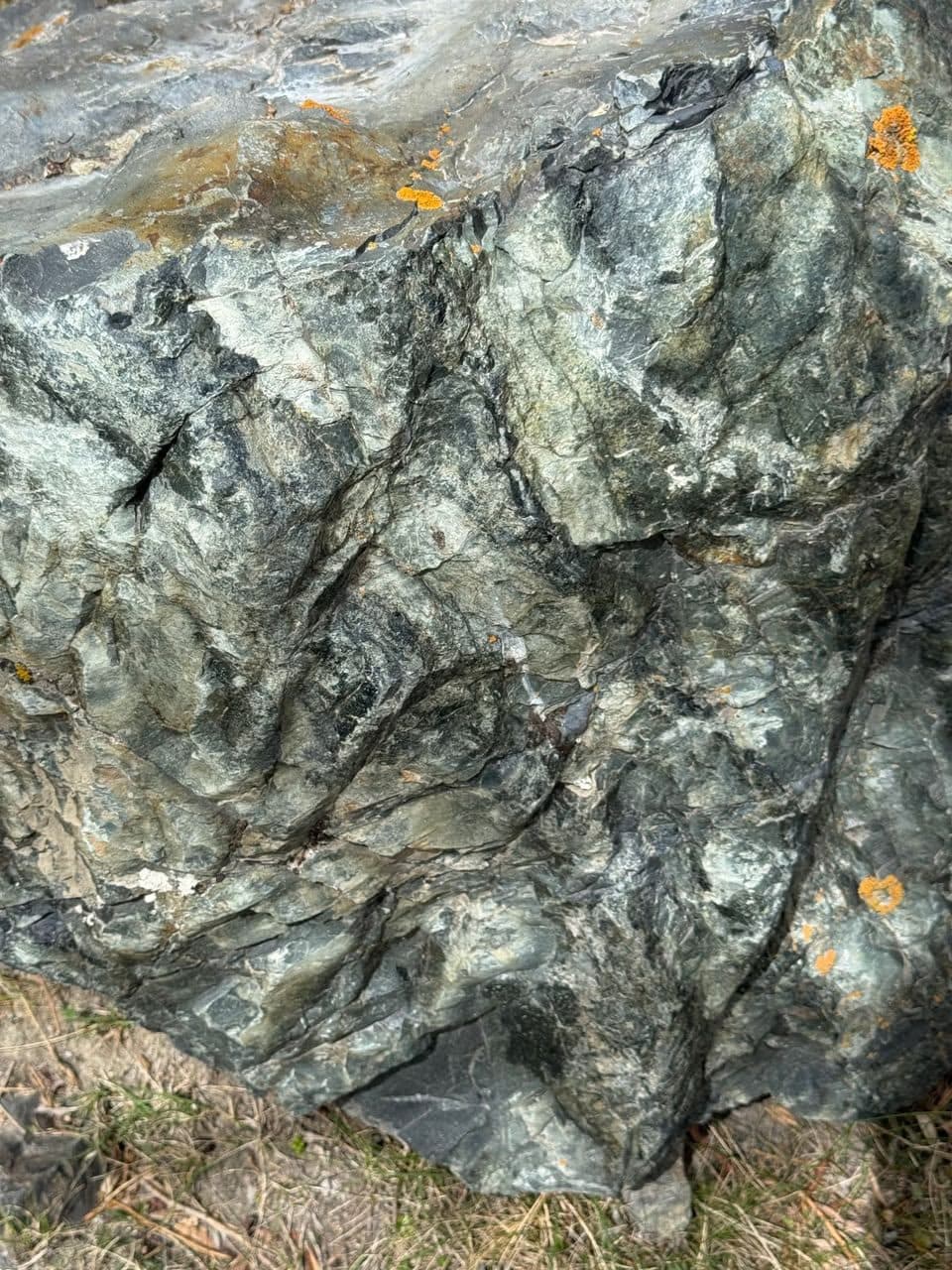 Green rock face at Hilal Abad, photographed in place.