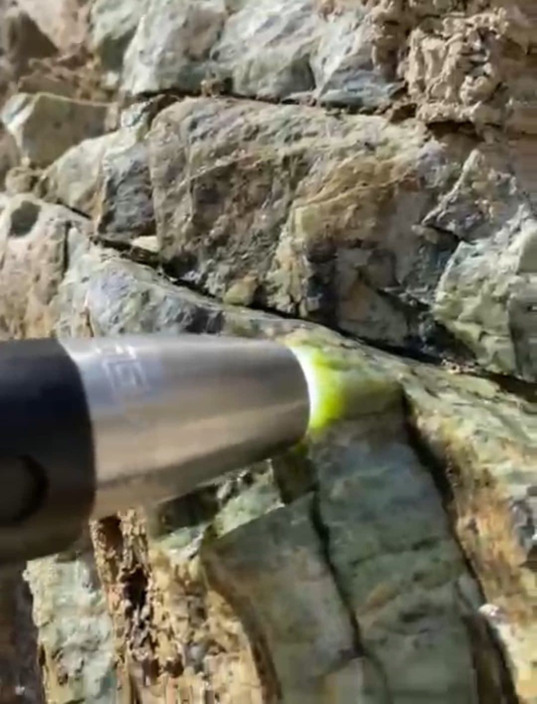 Torch test made on the outcrop itself, before anything is moved.